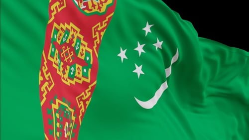 The Turkmenistan flag with alpha channel waving in the wind in slow motion