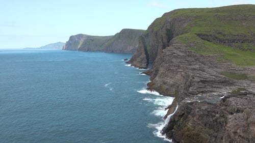 Coastal cliffs of remote islands. Breathtaking views of the vast ocean and dramatic landscapes.