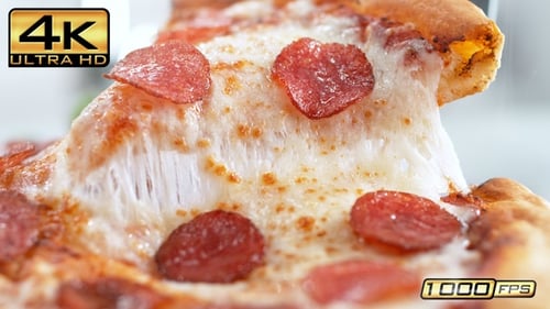 Delicious Pepperoni Pizza Slice Being Lifted With Spatula