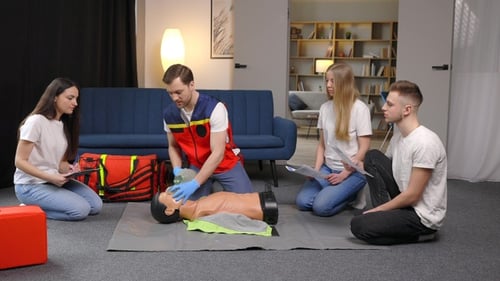 Adults Learning CPR and First Aid in Home