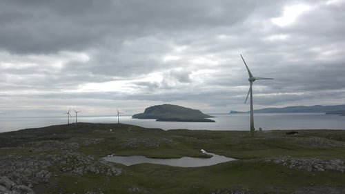 Wind Turbines on a Grassy Island Coast