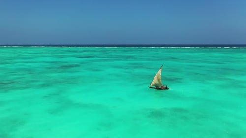 Sailboat in the ocean. Luxury yachting lifestyle at summer sunny day. Drone Shot of Sail Boat.