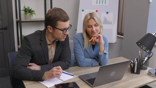 Start up business team on meeting in modern office interior, working on laptop and tablet