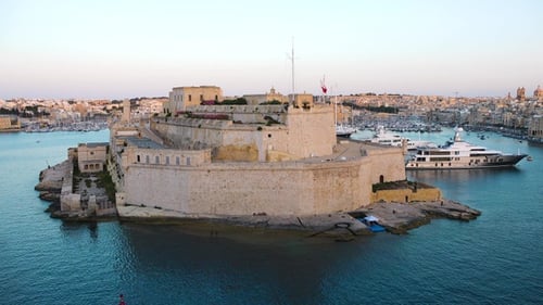 Exploring the stunning coastal views and historical architecture of Valletta, Malta at sunset.