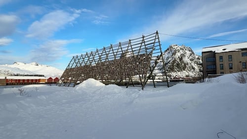 Fishing village in Norway with drying fish on racks