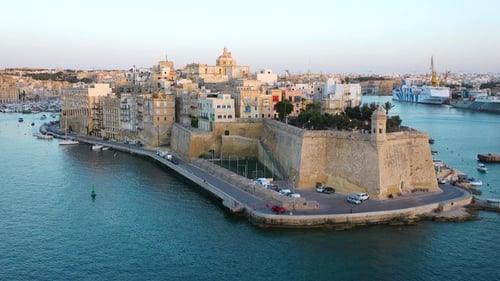 Exploring the stunning coastal views and historical architecture of Valletta, Malta at sunset.