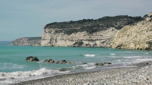 Picturesque beach, beautiful rocks, waves and turquoise water. Tropical nature. Summer holidays.