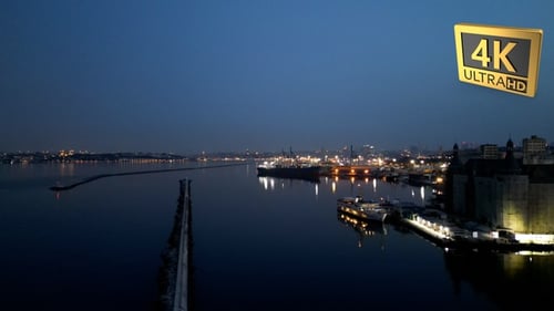 Vessel Travels on Water at Night Aerial View