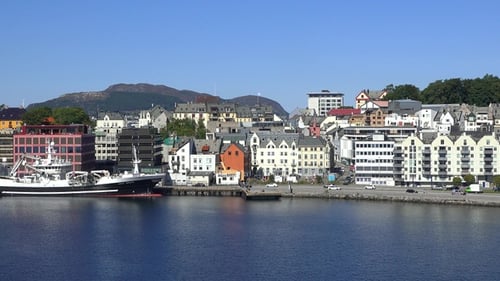 Alesund, Norway, houses on the water, boats, yachts. Cruise trip in Norway. Panorama of the city.