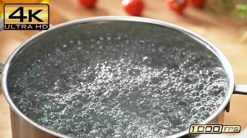 Pot of Water Bubbling on Stove in Kitchen