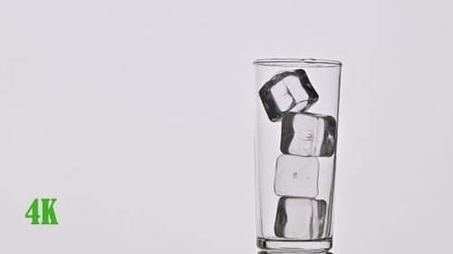 Pouring Refreshing Brown Beverage Over Ice