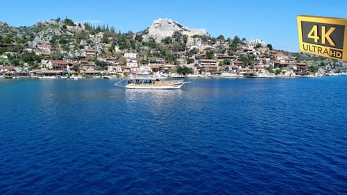 Aerial View of Coastal Town with Castle Ruins