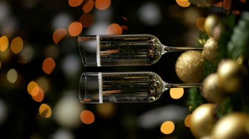 Holiday Champagne Cheers with Christmas Tree Bokeh