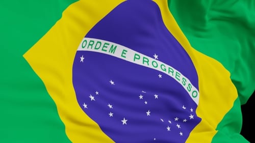 The Brazil flag with alpha channel waving in the wind in slow motion