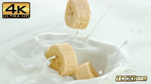 Banana Slices Falling Into White Liquid, Splash