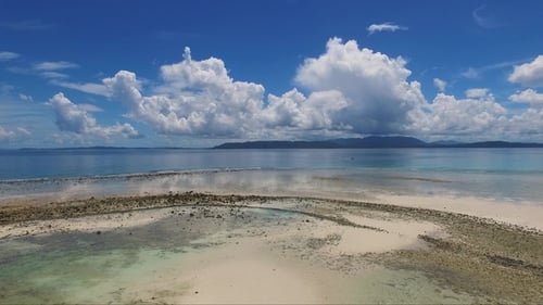 Beaches and islands of the Indian Ocean. Drone view of a tropical island and corral reef. Paradise.
