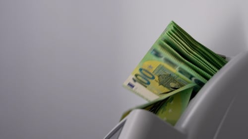 Money Counter Counting Stack of Green Euros