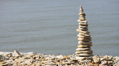 Cairn on the sea pebble beach