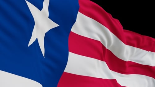 The Liberia flag with alpha channel waving in the wind in slow motion