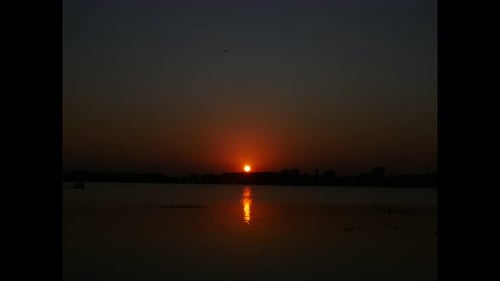 Glowing Sunset Over a Quiet Lake