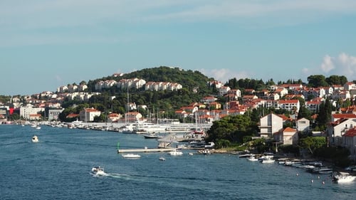 Stunning coastal view of a vibrant harbor in Croatia during a sunny summer day