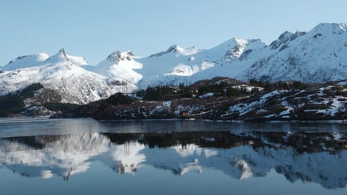 Beautiful nature. Norway fjords. Snow-capped mountains and a sea bay around. Winter landscape.