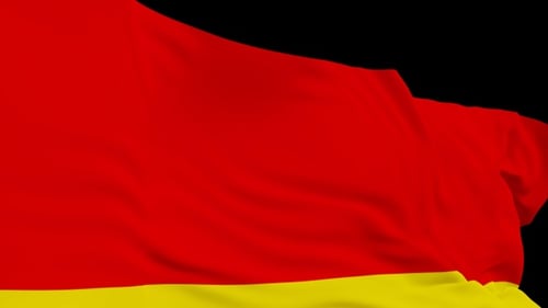 The Germany flag with alpha channel waving in the wind in slow motion