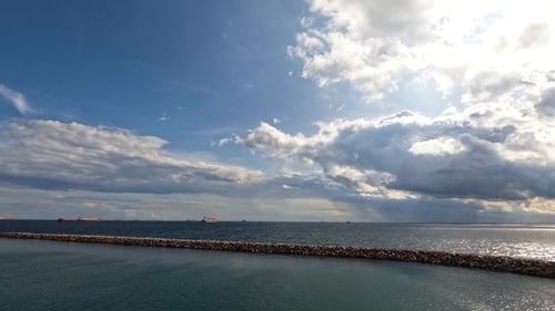 Dramatic sky. The sea, the horizon. Timelapse. Time lapse of fast flying clouds in the sky.