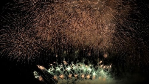 Golden Fireworks Exploding at Night