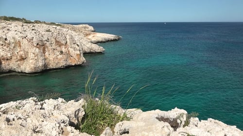 Picturesque seashore. Nature. Beautiful beach. Turquoise sea water and rocky shore. Marine landscape