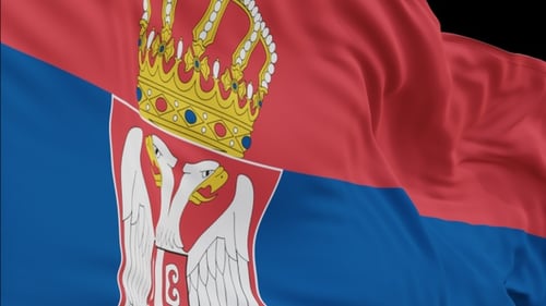 The Serbia flag with alpha channel waving in the wind in slow motion