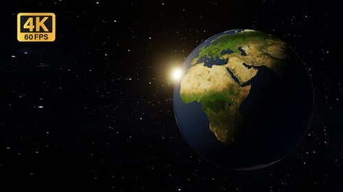 Earth Rotating in Space with Glowing Sunrise