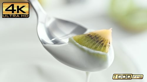 Kiwi slice in creamy yogurt close up shot