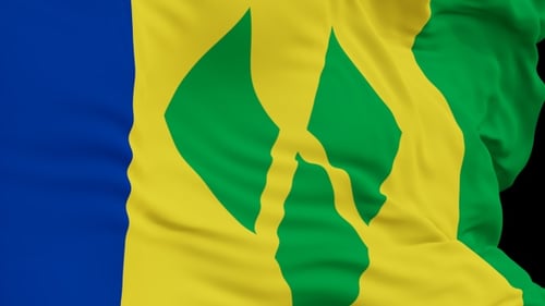 The Saint Vincent and the Grenadines with alpha channel waving in the wind in slow motion