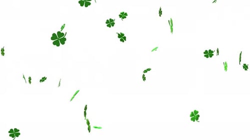 Clover leaves gently floating and falling through the air for St. Patrick's Day celebration
