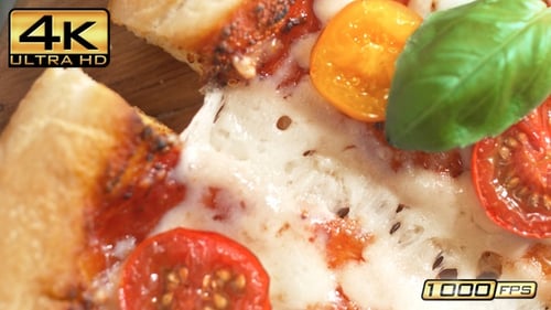 Tearing Slice of Margherita Pizza at 1000fps - Table Top View Stretchy Cheese Pull