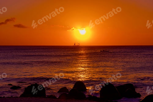 Preview: Bright And Colorful Sunset On The Caribbean Beach In Aruba Island In Winter With People On The