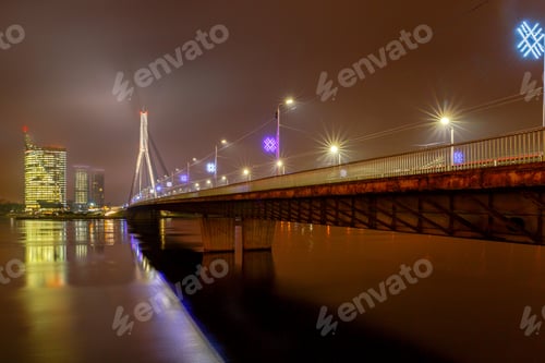 Preview: Modern Cable-Stayed Bridge Across The Daugava River In Riga Night.