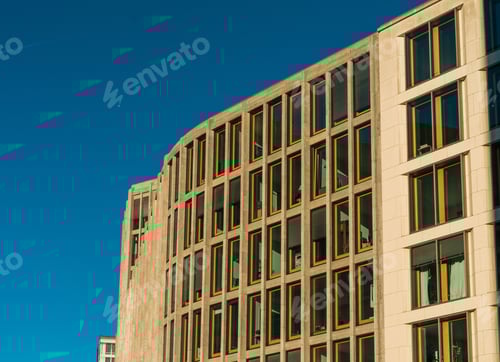 Preview: Office Building With Clean Facade And Long Windows And Darken Sky