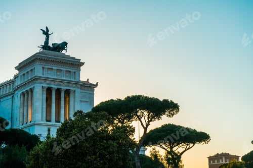 Preview: Victor Emmanuel Ii Monument In Rome, Italy Viewed Over Treetops At Sunrise Or Sunset Erected To