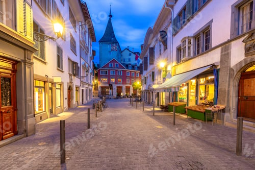 Preview: View Of The Old Narrow Medieval City Street With Burning Lanterns. Zurich. Switzerland.