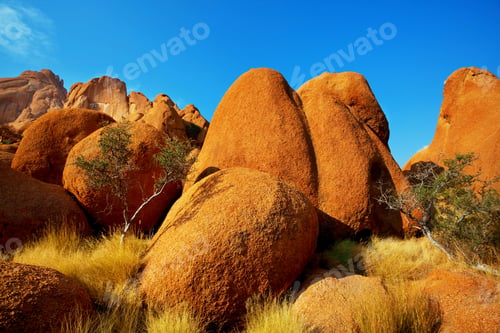 Preview: African Landscapes -Hot Yellow Bush, Stines, Trees And Blue Sky. Conceptual African Background.