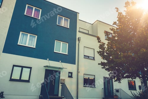 Preview: Beautiful Blue And White Townhouses With Autumn Tree