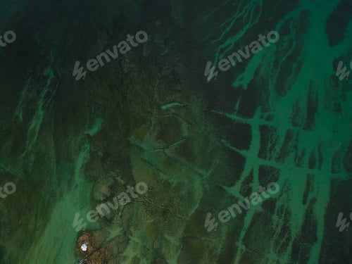 Preview: Aerial View Of The Beach On A Clear Day . Drone Shot On A Beach With Clear Sea Water.