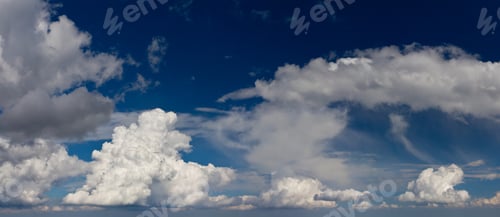 Preview: White Fluffy Clouds In The Fantastic Blue Sky. Overcast Sky Before Storm.