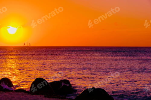 Preview: Bright And Colorful Sunset On The Caribbean Beach In Aruba Island In Winter With People On The