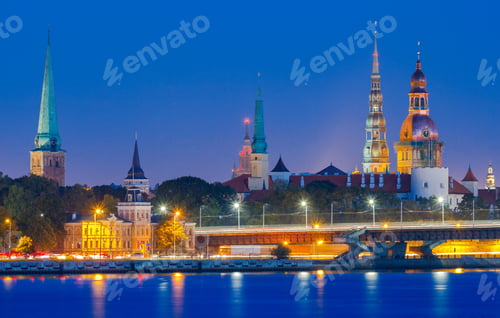 Preview: Evening View On The Embankment Of The Daugava River And The Spiers Of Churches In Riga.