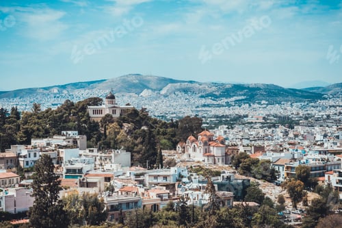 Preview: Overall Birds Eye View Of Modern And Ancient Buildings On Hills In Greece Under Hazy Sky