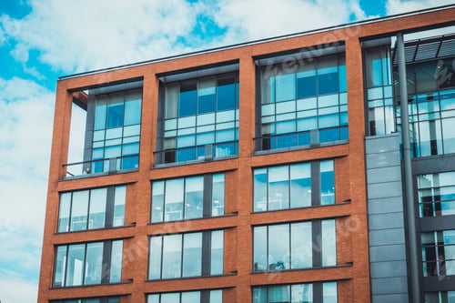 Preview: Detailed View Of An Office Building With Big Blue Windows