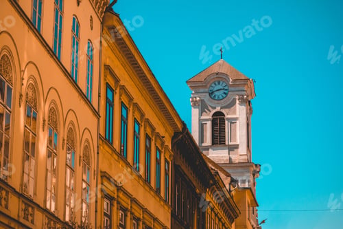 Preview: Small Church Tower With Residential Buildings In The Foreground